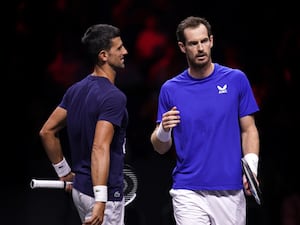 Andy Murray, right, talks to Novak Djokovic