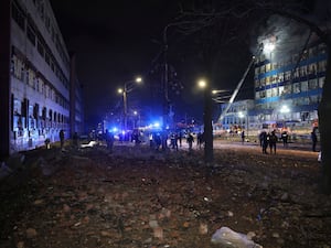 Rescuers work at the site of a Russian air strike in Zaporizhzhia