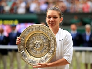 Simona Halep holds the Wimbledon trophy