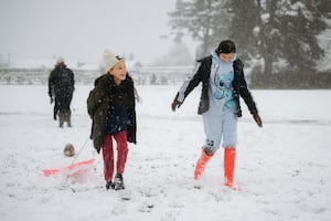 Sisters Nancy, 9, and Martha, 11, enjoying the snow as school is closed for the day