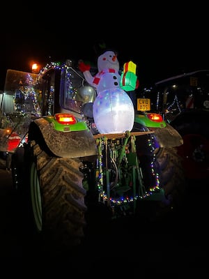 Another tractor which carried a snowman on its tour of the villages.