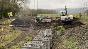 Work continues to profile the channel where it widens on a bend.