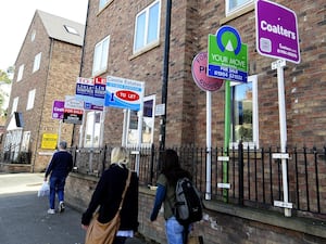 Estate agents' boards outside houses