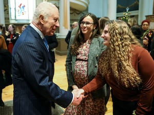 The King greeting people at a church in London