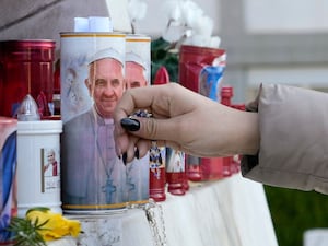 Candles and pictures of Pope Francis outside the Agostino Gemelli Polyclinic in Rome