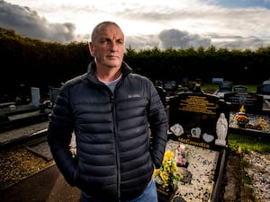 Michael McConville by his parents' grave