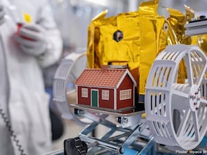 A red model house created by artist Mikael Genberg and scheduled to launch into space on a Falcon 9 rocket from Cape Canaveral in Florida on Wednesday