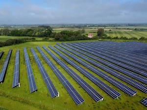 A field with solar panels in it