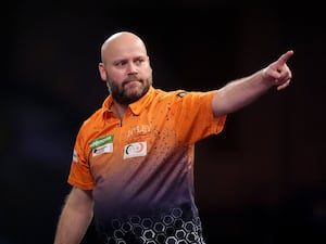 Christian Kist celebrates his nine-dart finish