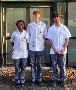 Claudia Afram, Callum McCarthy and Joel Sanjeev arriving to speak to the ICS board in Wellington
