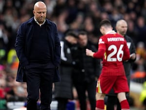 Liverpool manager Arne Slot reacts as Andy Robertson is shown a red card