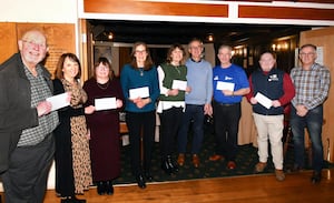 The recipients of the cheques and David Price (far right), pantomime writer and director. Ted Edwards Photography