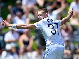 England bowler Gus Atkinson celebrates after taking a hat-trick