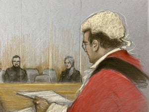 Court sketch showing an empty chair, two court officials on either side and Justice Goose