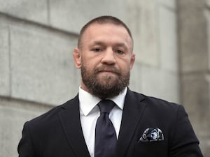 Conor McGregor leaves the High Court in Dublin (PA)