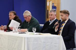 Moore was alongside, Gareth Ainsworth, Liam Dooley and Roger Groves (supporter liaison officer) on Thursday night.  (AMA)