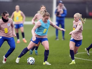 England’s Keira Walsh (centre) and Laura Blindkilde Brown (right) during a training session