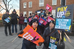 Peter Grue and Jean Parkes with other striking workers on the picket.