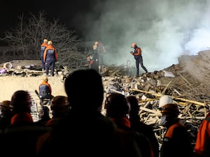 Rescuers at the scene of a collapsed building