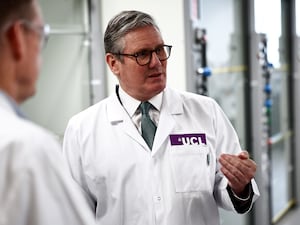 Prime Minister Sir Keir Starmer speaks with researchers and professors during a visit to a laboratory