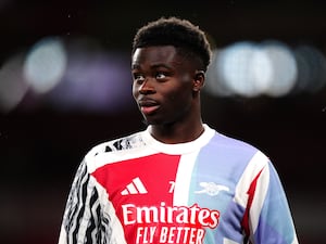 Arsenal’s Bukayo Saka warming up