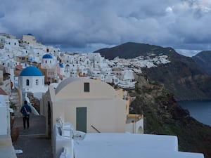 Blue-domed Orthodox churches in the town of Oia on the earthquake-struck island of Santorini