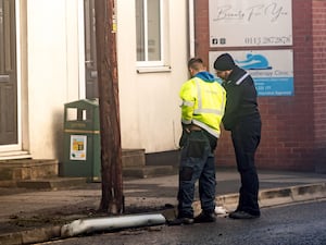 Police officers outside the Old Tree Inn pub on the High Street in Kippax, where a seven-year-old girl was seriously injured in a quad bike accident