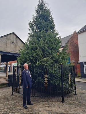 Market Drayton Mayor Roy Aldcroft next to the town's Christmas tree.