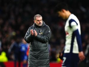 Tottenham Hotspur manager Ange Postecoglou (left) applauds the fans