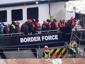 People thought to be migrants disembark from a Border Force vessel at the Port of Dover