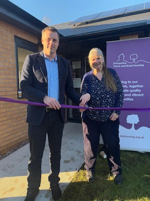 Robert Macey, Shropshire Councillor for Weston Rhyn and Maggie Rowlands, Chair of Weston Rhyn Parish Council, officially opening the Aspen Grange purpose built community room.

