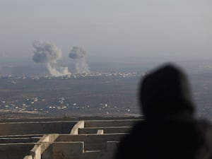 Smoke rises amid fighting between opposition factions and Syrian government troops in Majdaliya