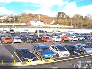 Car park at Derriford Hospital with helicopter in background