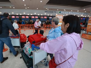 Passengers at Belfast International Airport during an air traffic control failure