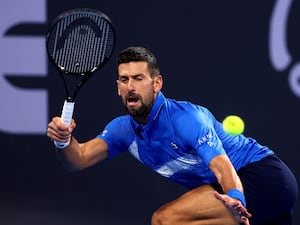 Novak Djokovic returns a shot to USA’s Reilly Opelka