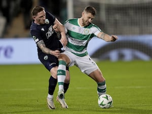 Shamrock Rovers' Lee Grace battles with The New Saints striker Declan McManus
