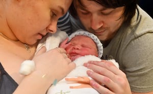 Baby Milo Edwards, who was born on Christmas Day, with parents Korline Newman and Reece Edwards