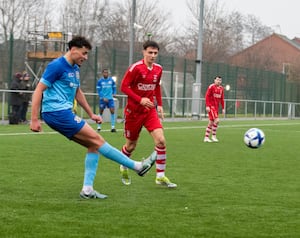 Action from Studley v Whitchurch Alport. Luca Whitney looks to close down a clearance. (Picture: Liam Pritchard)