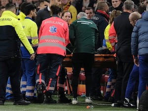 Medics carry Hungary assistant coach Adam Szalai from the pitch during the UEFA Nations League match between Netherlands and Hungary