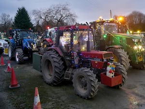 54 tractors covered in lights, carrying Santa, snowmen, reindeer, antlers and a large rubber duck took part.