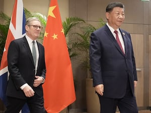 Sir Keir Starmer walks near Xi Jinping