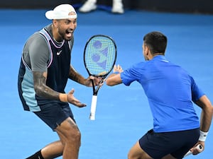 Nick Kyrgios and Novak Djokovic celebrate