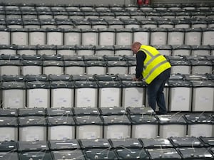 Michael Lennard sealing ballot boxes at a secure facility in west Dublin (Niall Carson/PA)