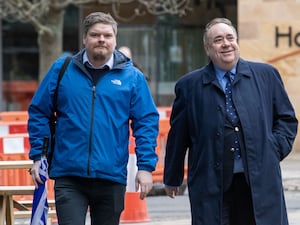 Chris McEleny walking outside with Alex Salmond