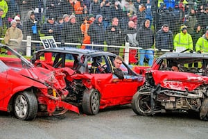 A South driver reviews the damage on his car