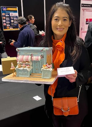 Mabel Mae Agnew with her shop-front cake which won a bronze award.