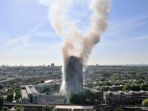 Smoke billows from the 24-storey Grenfell Tower in west London in June 2017