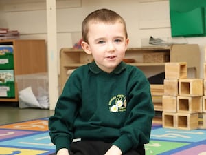 Handout photo of Lincoln Button in school uniform