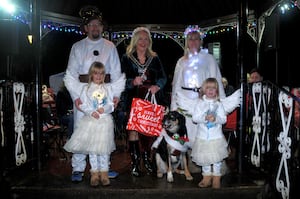 The Bridson family with Jenson the dog, who won first prize in the fancy dress competition, being presented with their prize by Llandrindod Wells Mayor Councillor Marcia Morgan. Image: Andy Compton