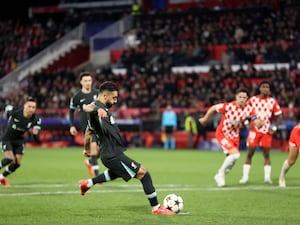 Mohamed Salah sidefoots a penalty with his left foot